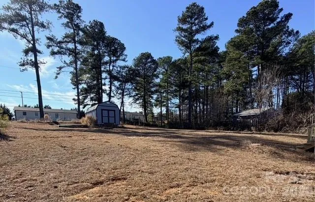 a backyard of a house with trees