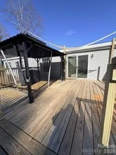 a view of sitting area with wooden fence
