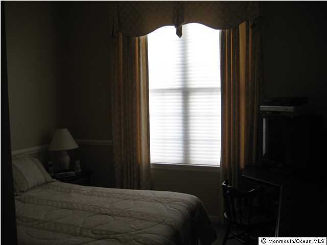 23 Shoal Road Jackson, NJ 08527 - Photo 14 of 21 a bedroom with a bed and a window