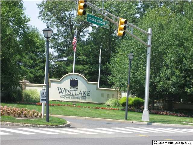 23 Shoal Road Jackson, NJ 08527 - Photo 16 of 21 a sign that is on the side of a road