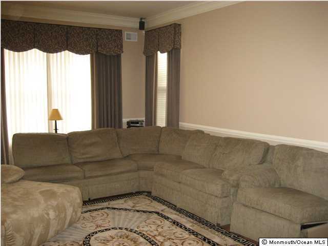 23 Shoal Road Jackson, NJ 08527 - Photo 4 of 21 a living room with furniture and a large window