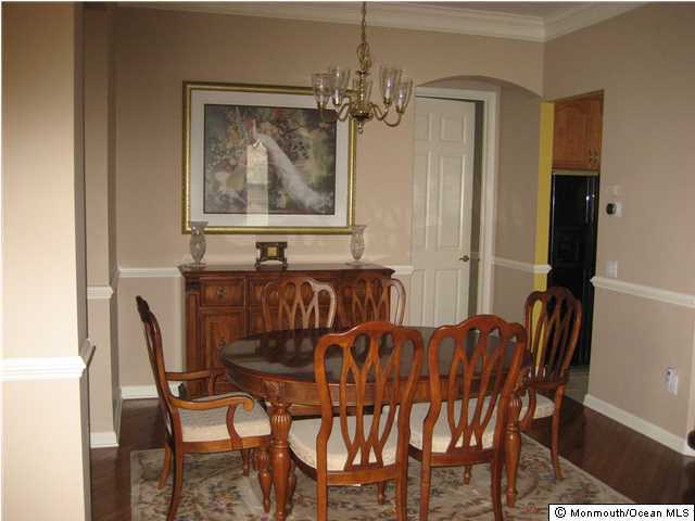 23 Shoal Road Jackson, NJ 08527 - Photo 8 of 21 a view of a dining room with furniture and a chandelier
