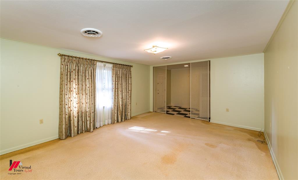 205 7th Street Northeast Springhill, LA 71075 - Photo 16 of 40 Recessed ceiling lighting, ceiling-mounted light fixture, sliding closet doors, checkerboard floor tile in closet, and a wall-mounted electrical outlet