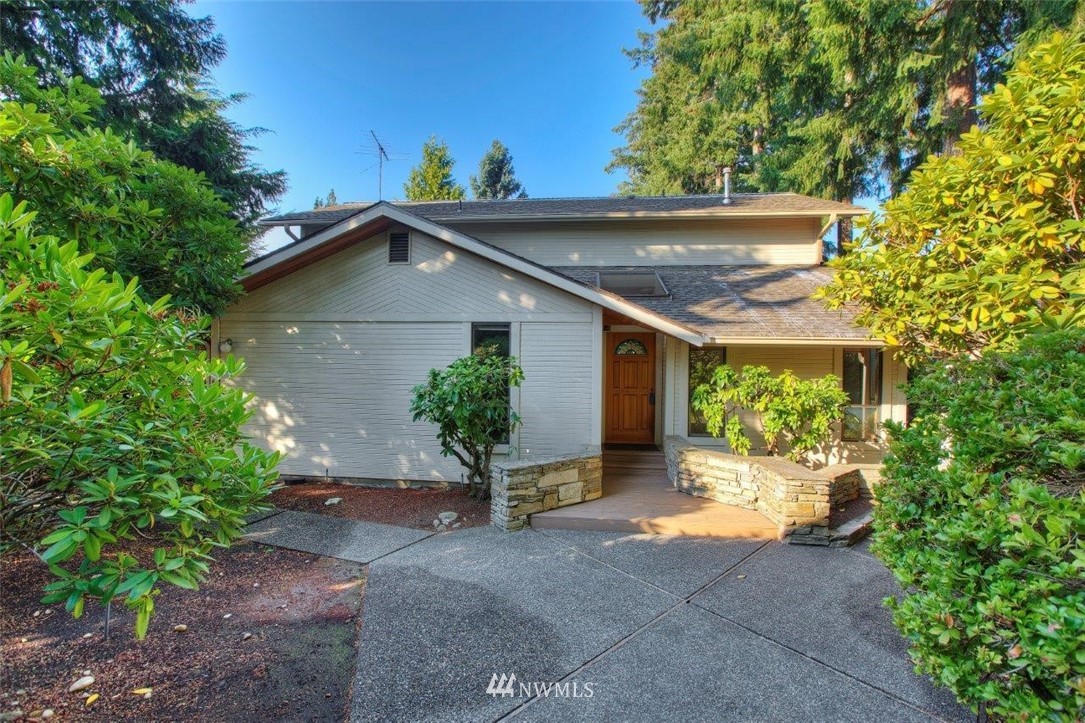 1822 Channel Road East Lake Tapps, WA 98391 - Photo 2 of 38 a view of a house with a yard plants and large tree