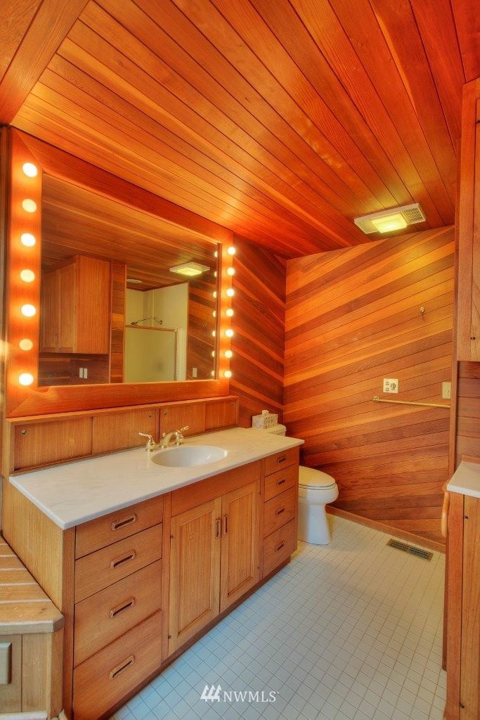 1822 Channel Road East Lake Tapps, WA 98391 - Photo 11 of 38 a bathroom with a sink and a mirror