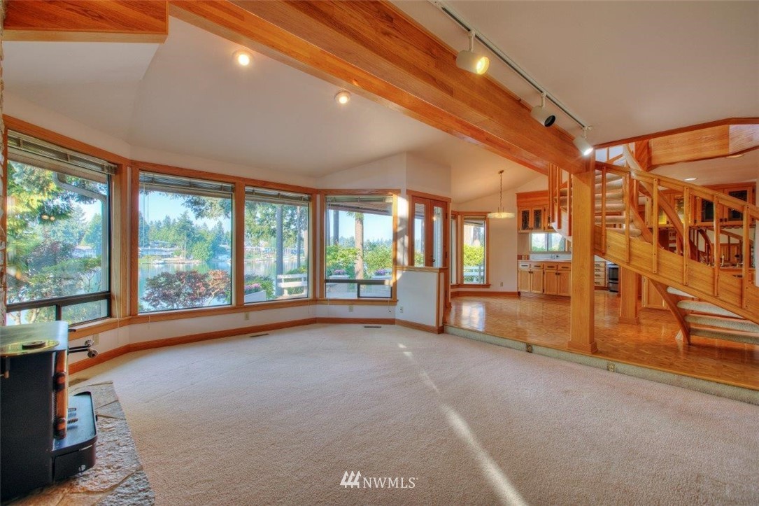 1822 Channel Road East Lake Tapps, WA 98391 - Photo 15 of 38 a view of an empty room with large windows