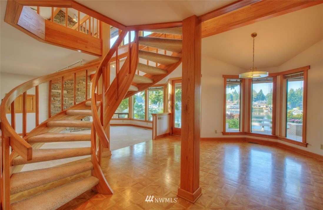 1822 Channel Road East Lake Tapps, WA 98391 - Photo 17 of 38 a view of an entryway with a floor to ceiling window and wooden floor