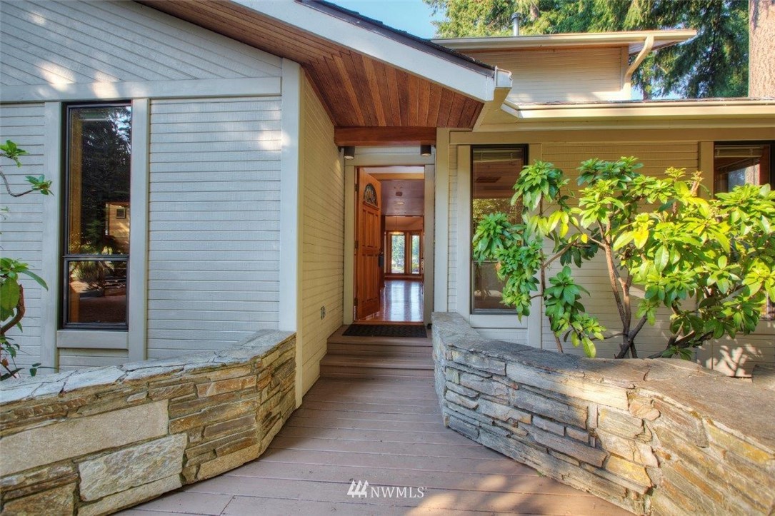 1822 Channel Road East Lake Tapps, WA 98391 - Photo 3 of 38 a view of front door of house with potted plant