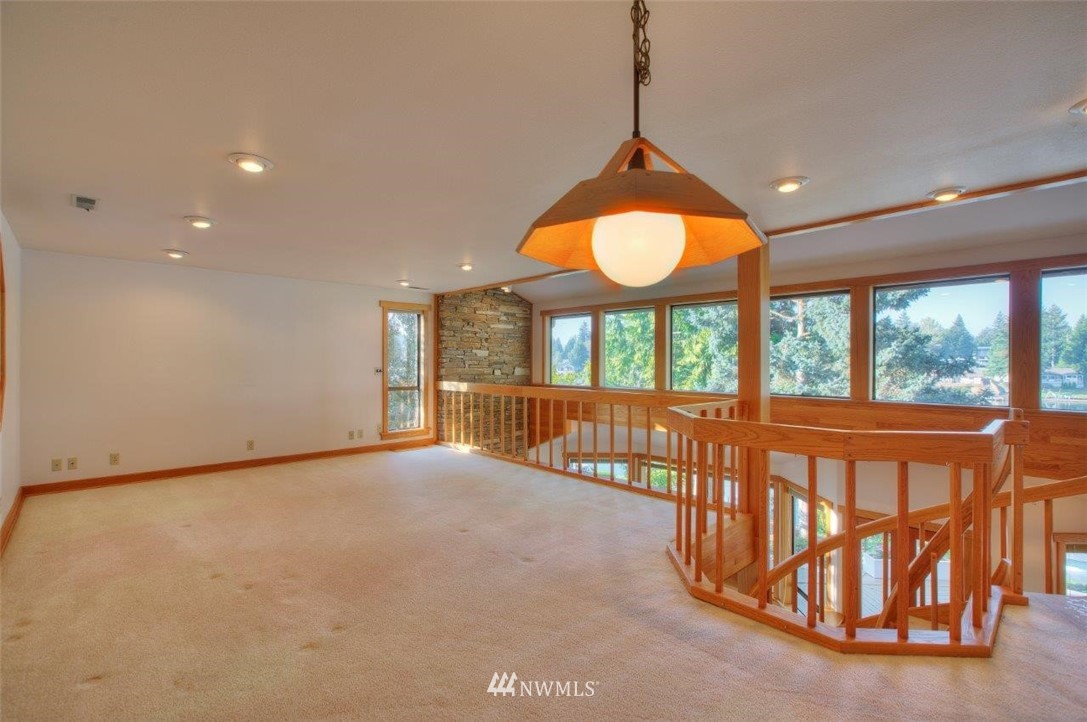 1822 Channel Road East Lake Tapps, WA 98391 - Photo 22 of 38 wooden floor in an empty room with a window