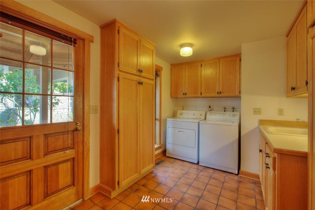 1822 Channel Road East Lake Tapps, WA 98391 - Photo 27 of 38 a view of a kitchen with white cabinets