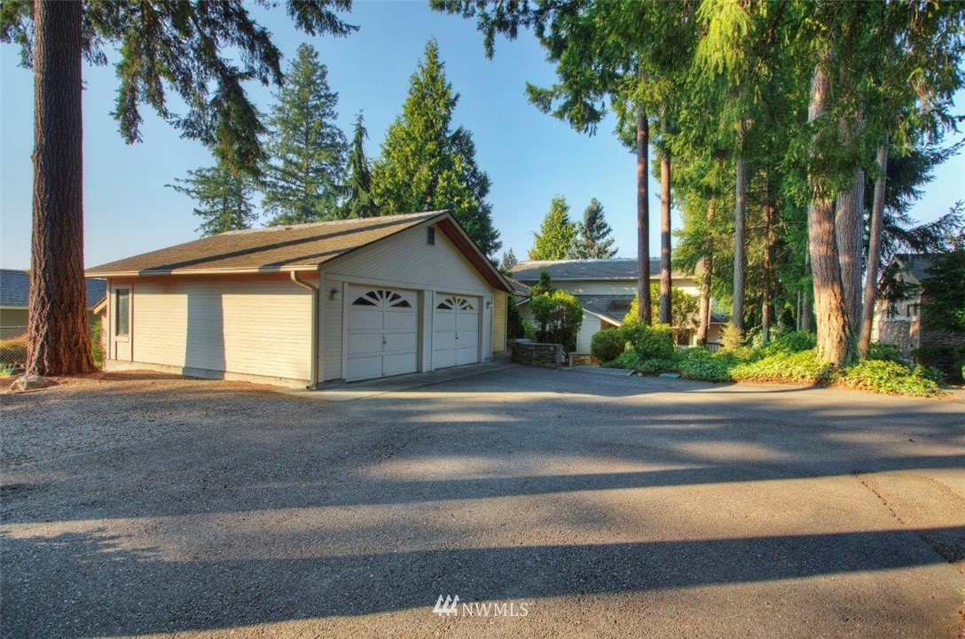 1822 Channel Road East Lake Tapps, WA 98391 - Photo 4 of 38 front view of a house with a street