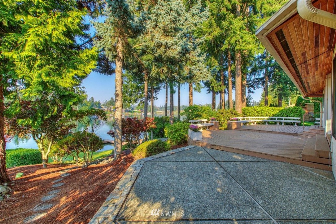 1822 Channel Road East Lake Tapps, WA 98391 - Photo 31 of 38 a view of a street with large trees