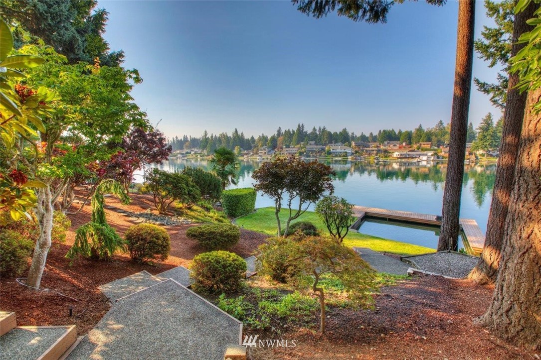 1822 Channel Road East Lake Tapps, WA 98391 - Photo 33 of 38 a view of a lake with a big yard
