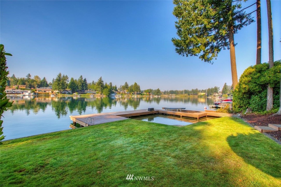 1822 Channel Road East Lake Tapps, WA 98391 - Photo 34 of 38 a view of a lake with houses in the back
