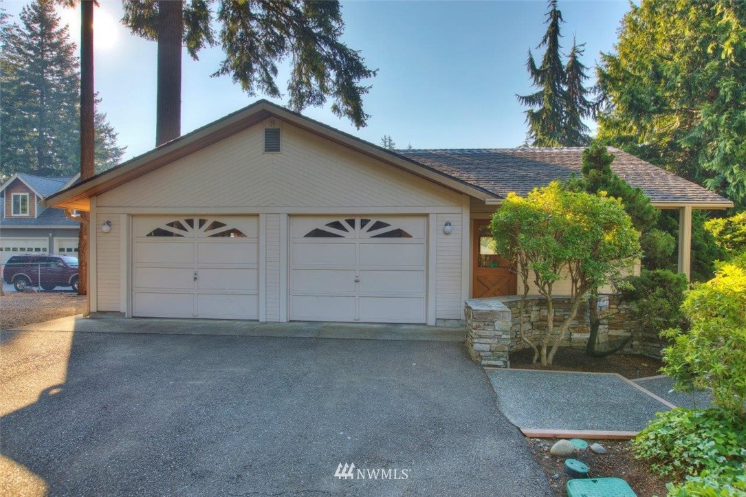 1822 Channel Road East Lake Tapps, WA 98391 - Photo 37 of 38 a view of a house with a yard