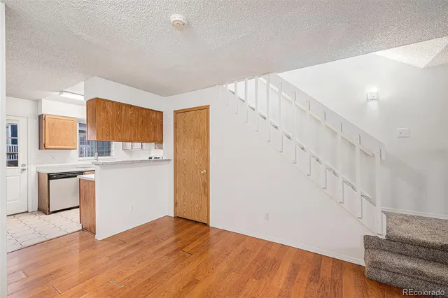 a kitchen with stainless steel appliances a stove a sink and a microwave