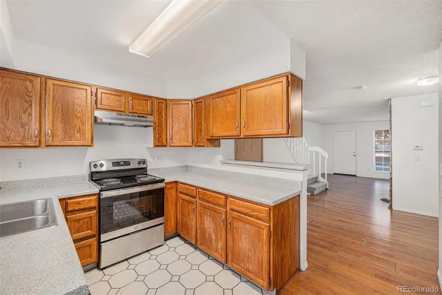 a white refrigerator freezer sitting in a kitchen