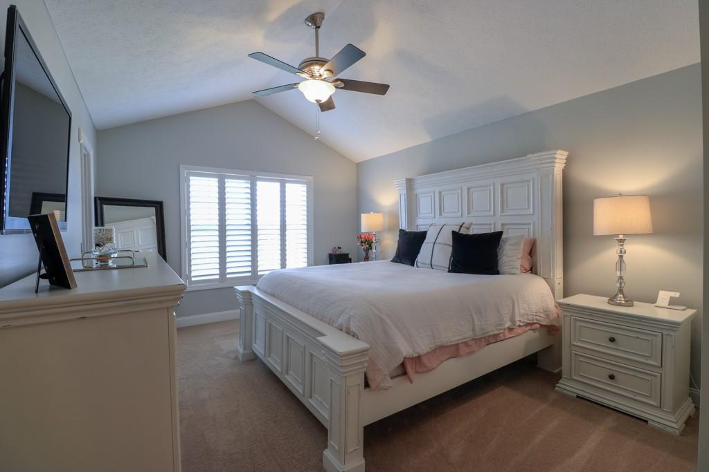 549 Dorchester Drive Seven Fields, PA 16046 - Photo 16 of 35 a bedroom with a bed and a chandelier