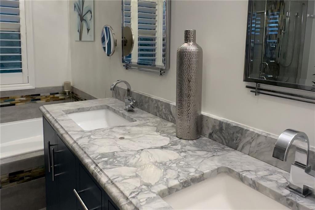 549 Dorchester Drive Seven Fields, PA 16046 - Photo 18 of 35 a bathroom with a granite countertop sink and a mirror