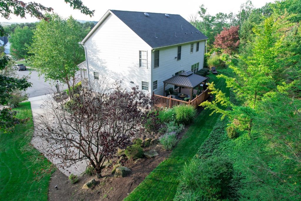 549 Dorchester Drive Seven Fields, PA 16046 - Photo 28 of 35 a view of a house with a yard and sitting area