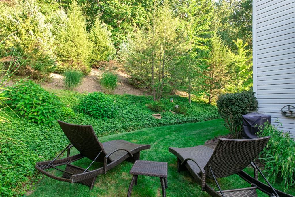 549 Dorchester Drive Seven Fields, PA 16046 - Photo 34 of 35 a view of a chairs and table in backyard of the house