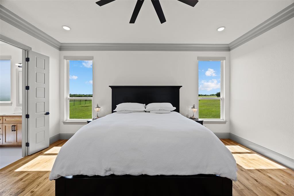 6317 Vega Road Godley, TX 76044 - Photo 11 of 27 a bedroom with a bed and a window
