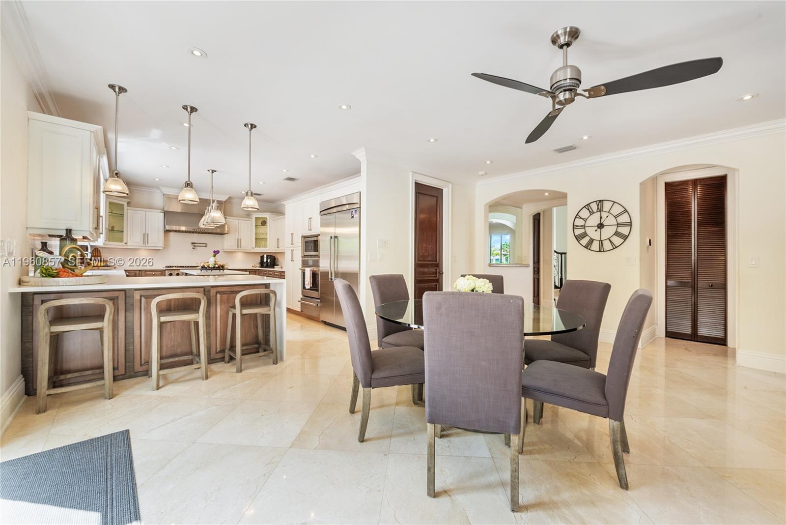 5621 Southwest 68th Court Miami, FL 33143 - Photo 11 of 18 a dining room with furniture a rug and a painting