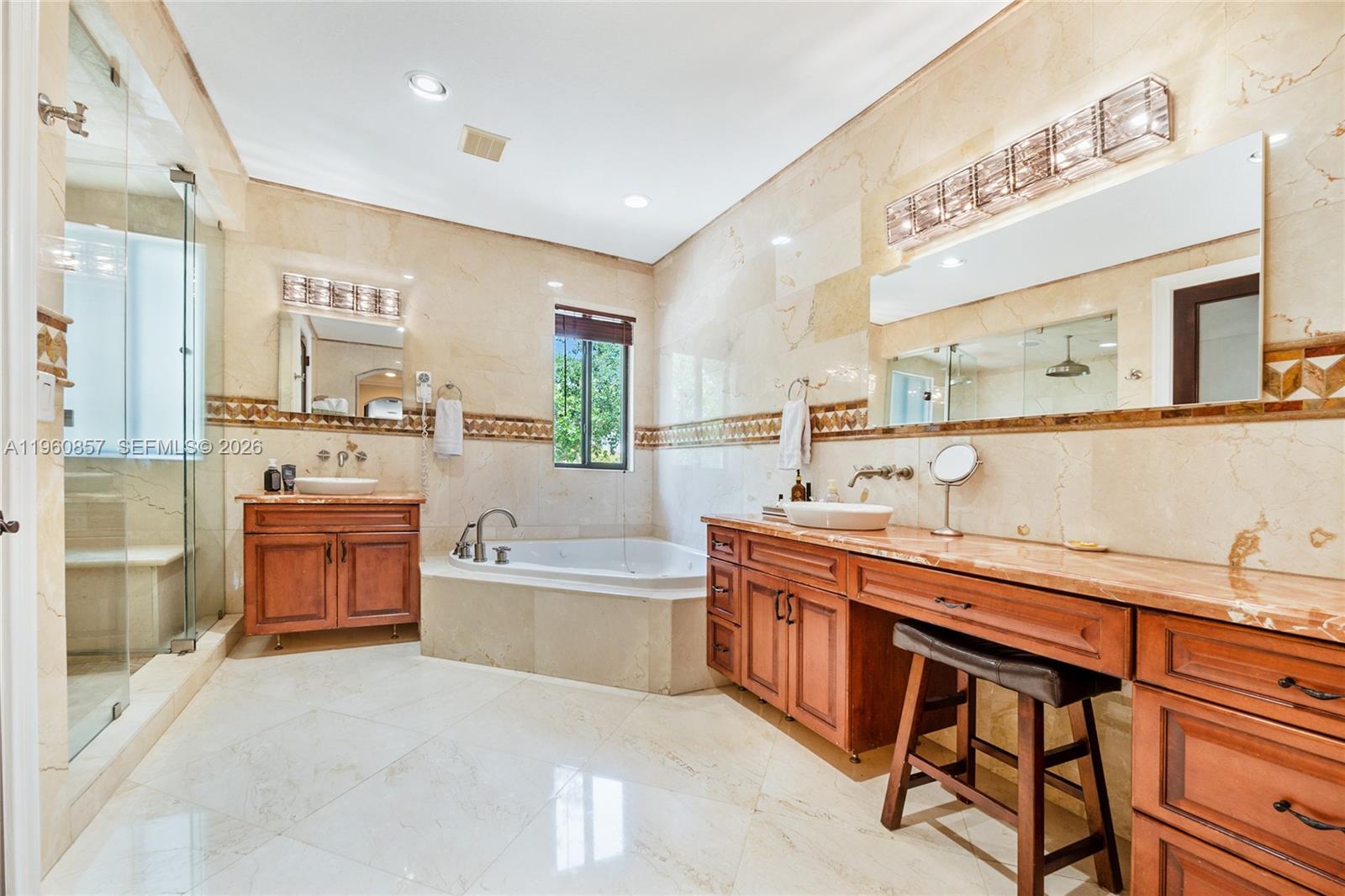 5621 Southwest 68th Court Miami, FL 33143 - Photo 13 of 18 a large kitchen with a table and chairs in it