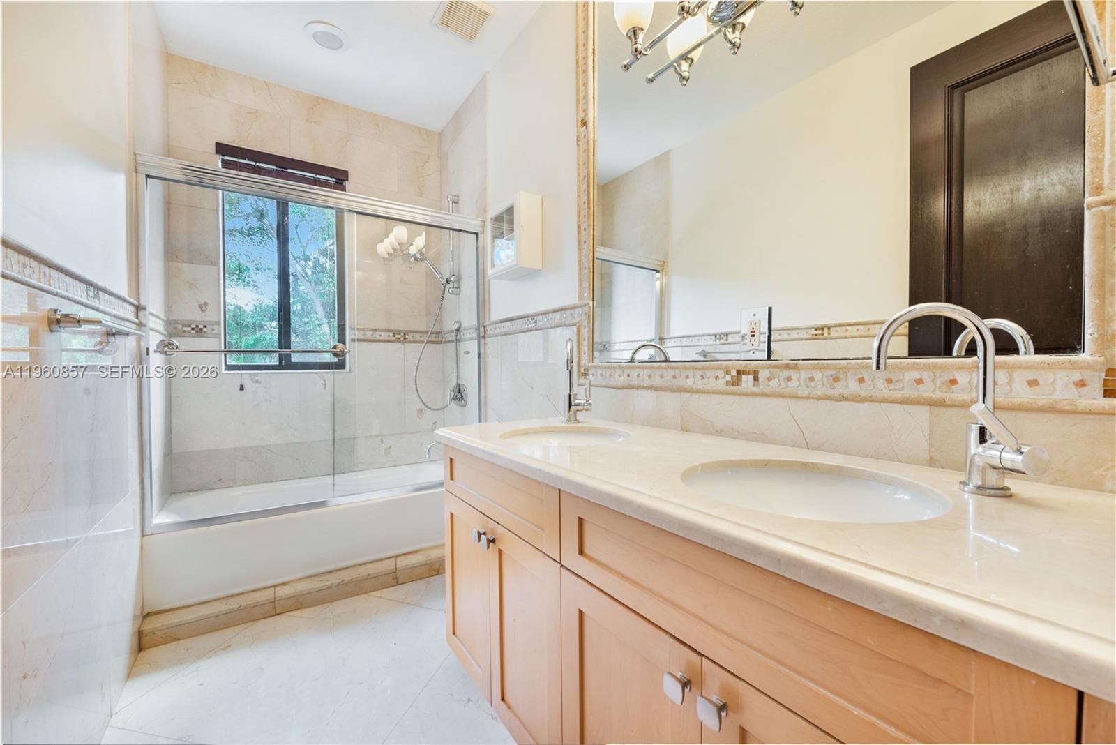 5621 Southwest 68th Court Miami, FL 33143 - Photo 16 of 18 a bathroom with a sink and a bathtub
