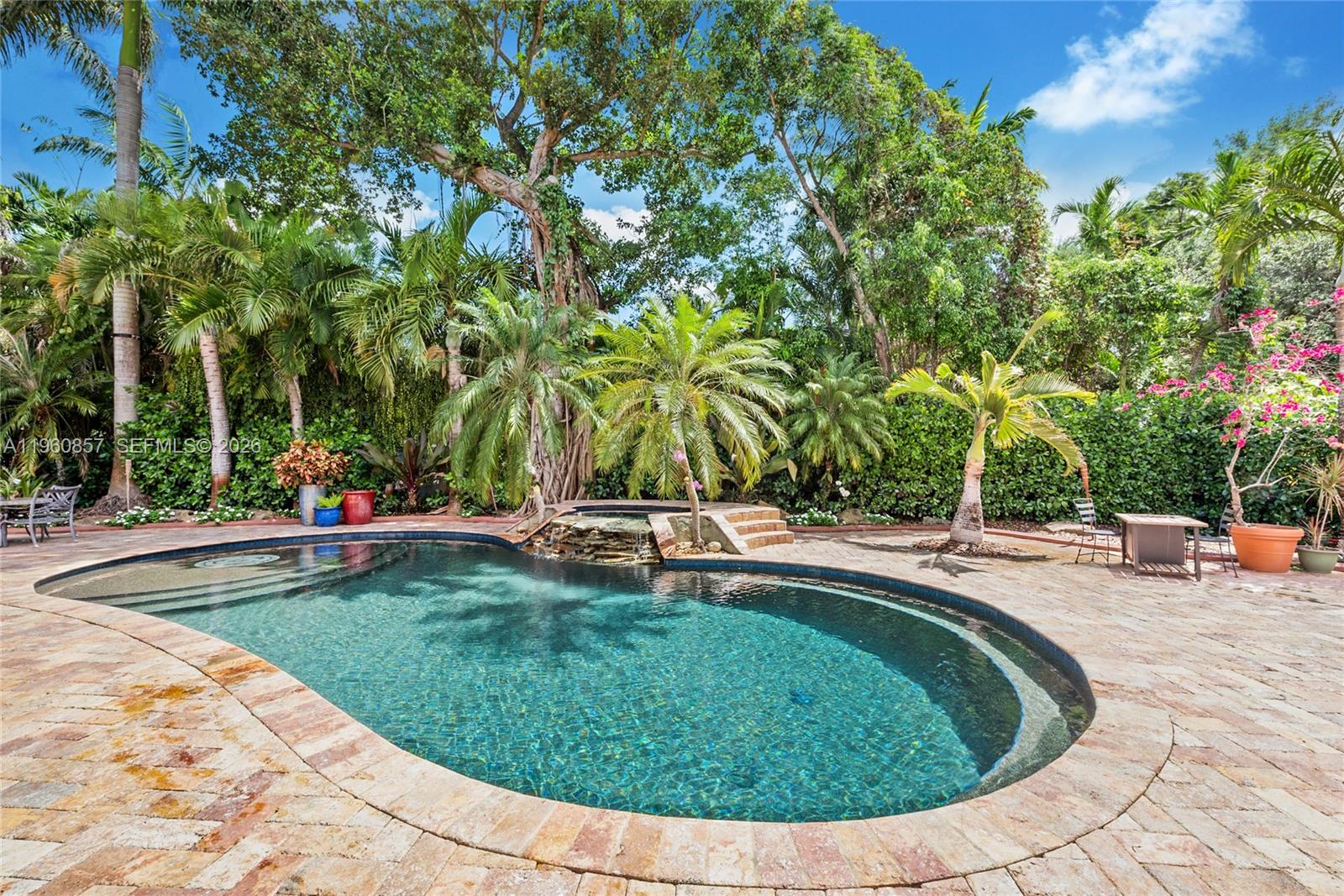 5621 Southwest 68th Court Miami, FL 33143 - Photo 5 of 18 a view of a swimming pool with a sitting area
