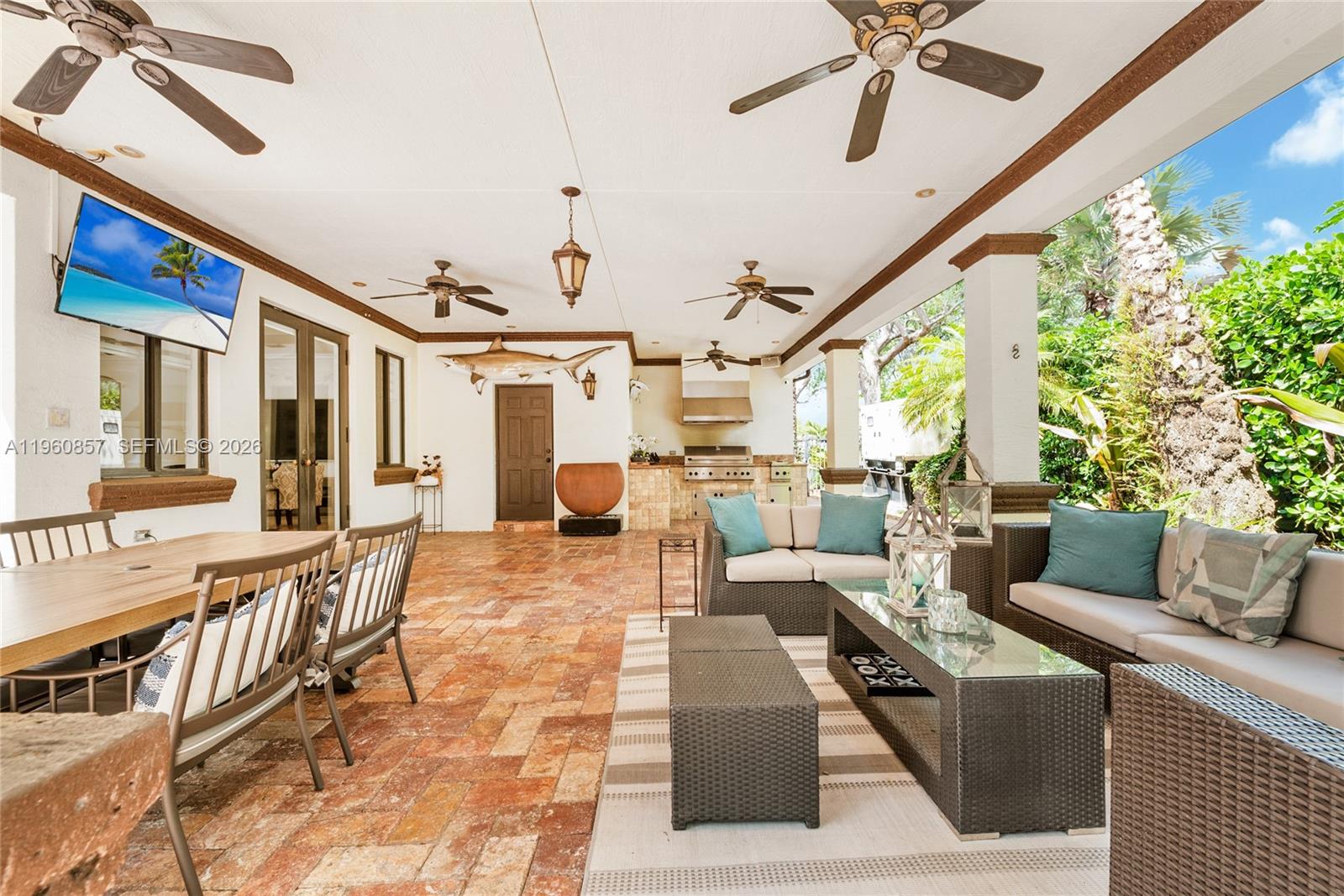 5621 Southwest 68th Court Miami, FL 33143 - Photo 6 of 18 a living room with furniture and a large window