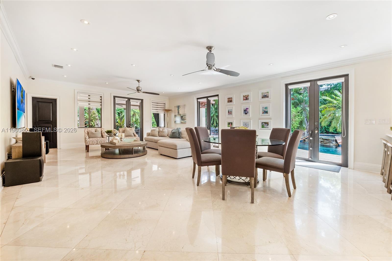 5621 Southwest 68th Court Miami, FL 33143 - Photo 9 of 18 a view of a dining room with furniture window and outside view