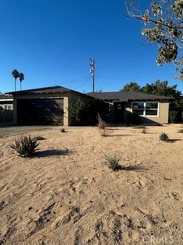 a view of swimming pool with a yard