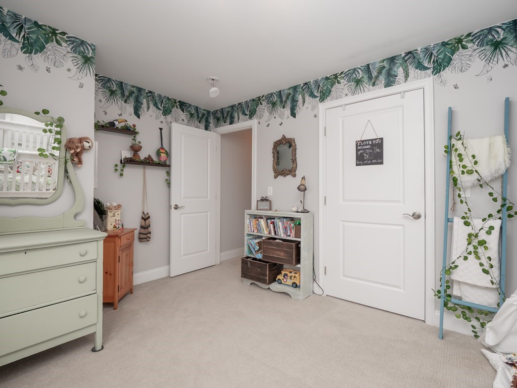 66 Oak Street, Unit 66 Clinton, MA 01510 - Photo 13 of 26 a view of a bedroom with closet and workspace