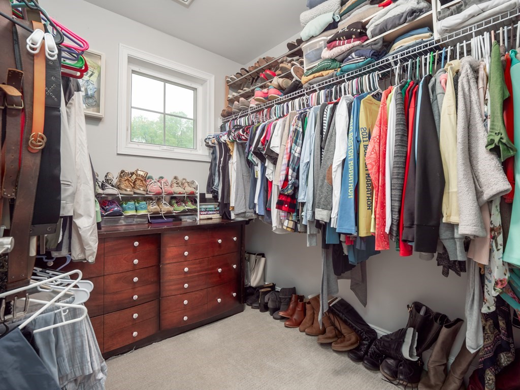 66 Oak Street, Unit 66 Clinton, MA 01510 - Photo 18 of 26 a view of walk in closet with clothes and shoes
