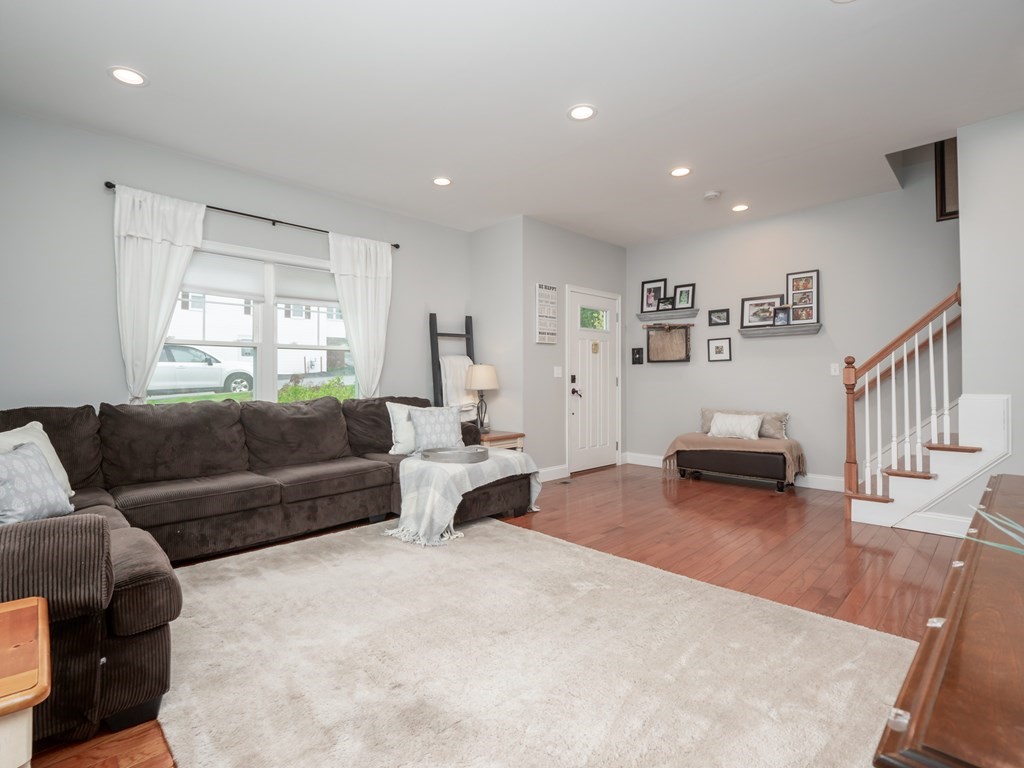 66 Oak Street, Unit 66 Clinton, MA 01510 - Photo 3 of 26 a living room with furniture and a window