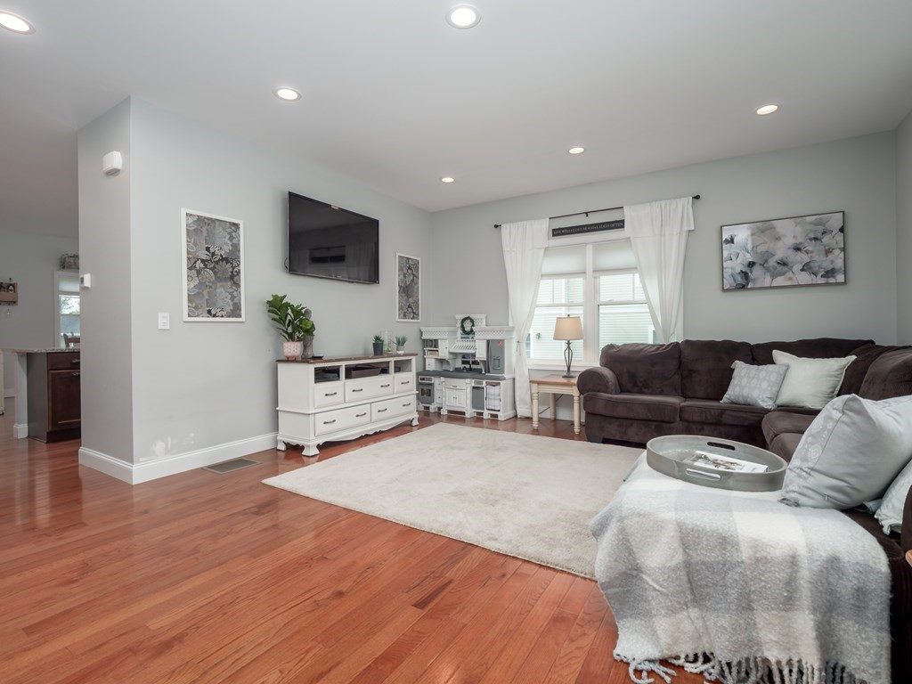 66 Oak Street, Unit 66 Clinton, MA 01510 - Photo 5 of 26 a living room with furniture and a flat screen tv