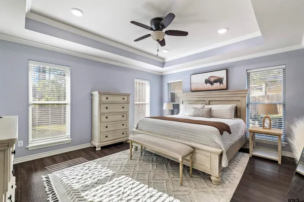 a bedroom with a large bed and a window