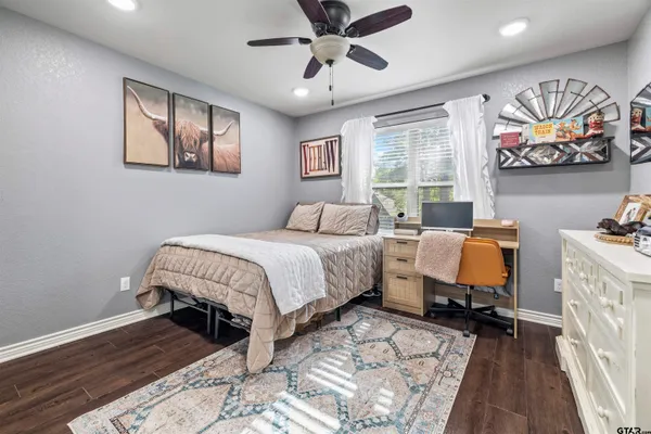 a bedroom with bed and window