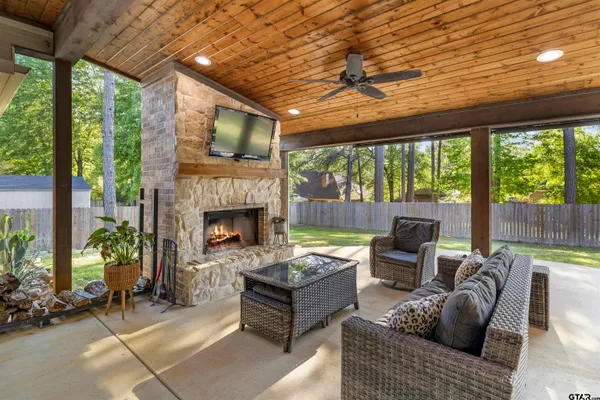 a outdoor space with patio fireplace and furniture