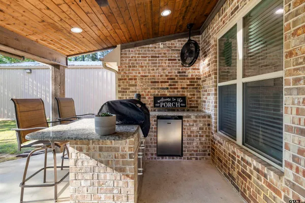 a view of barbecue area and seating area