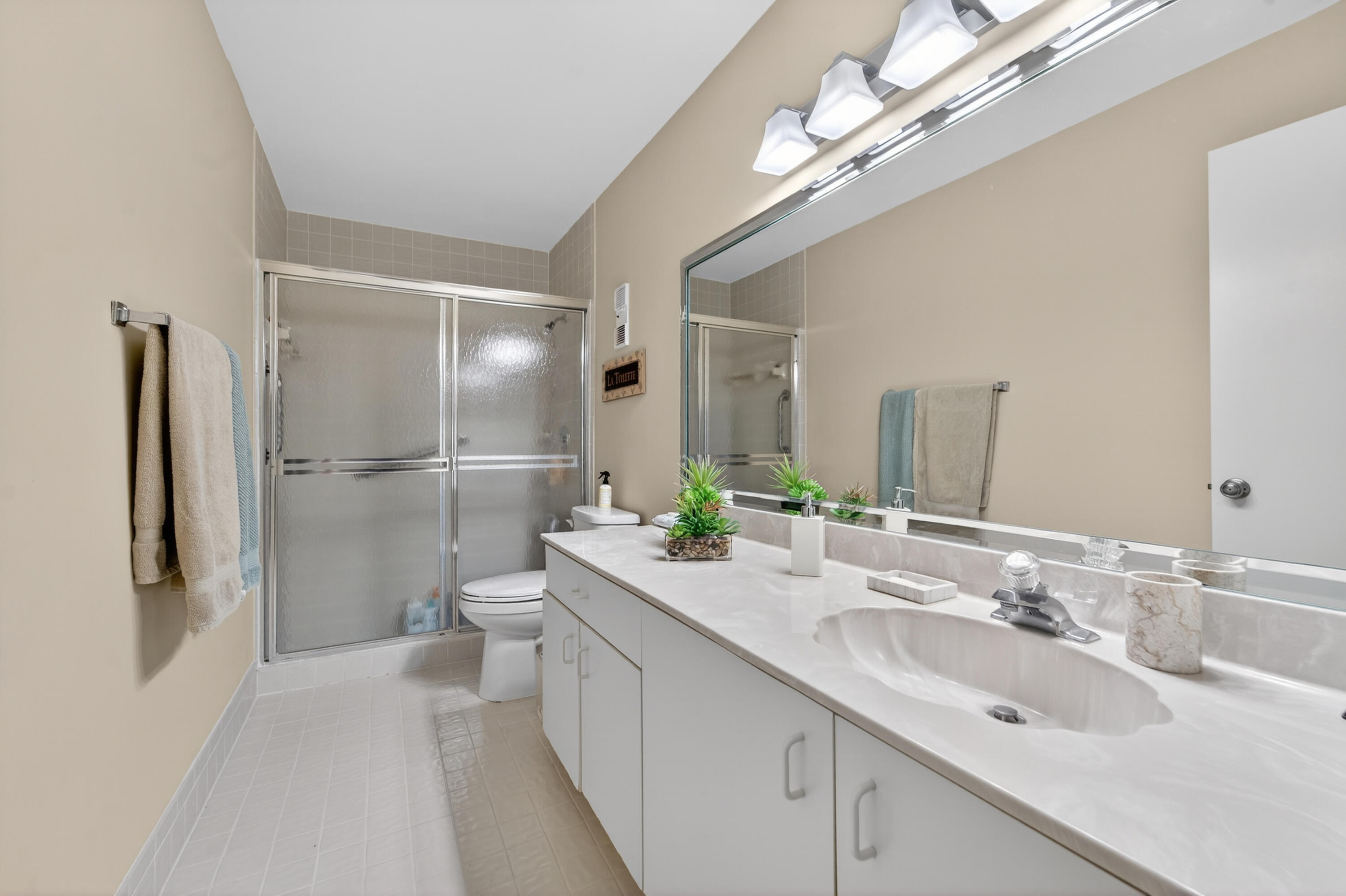 6224 Kings Gate Circle Delray Beach, FL 33484 - Photo 11 of 53 a bathroom with a double vanity sink and a mirror