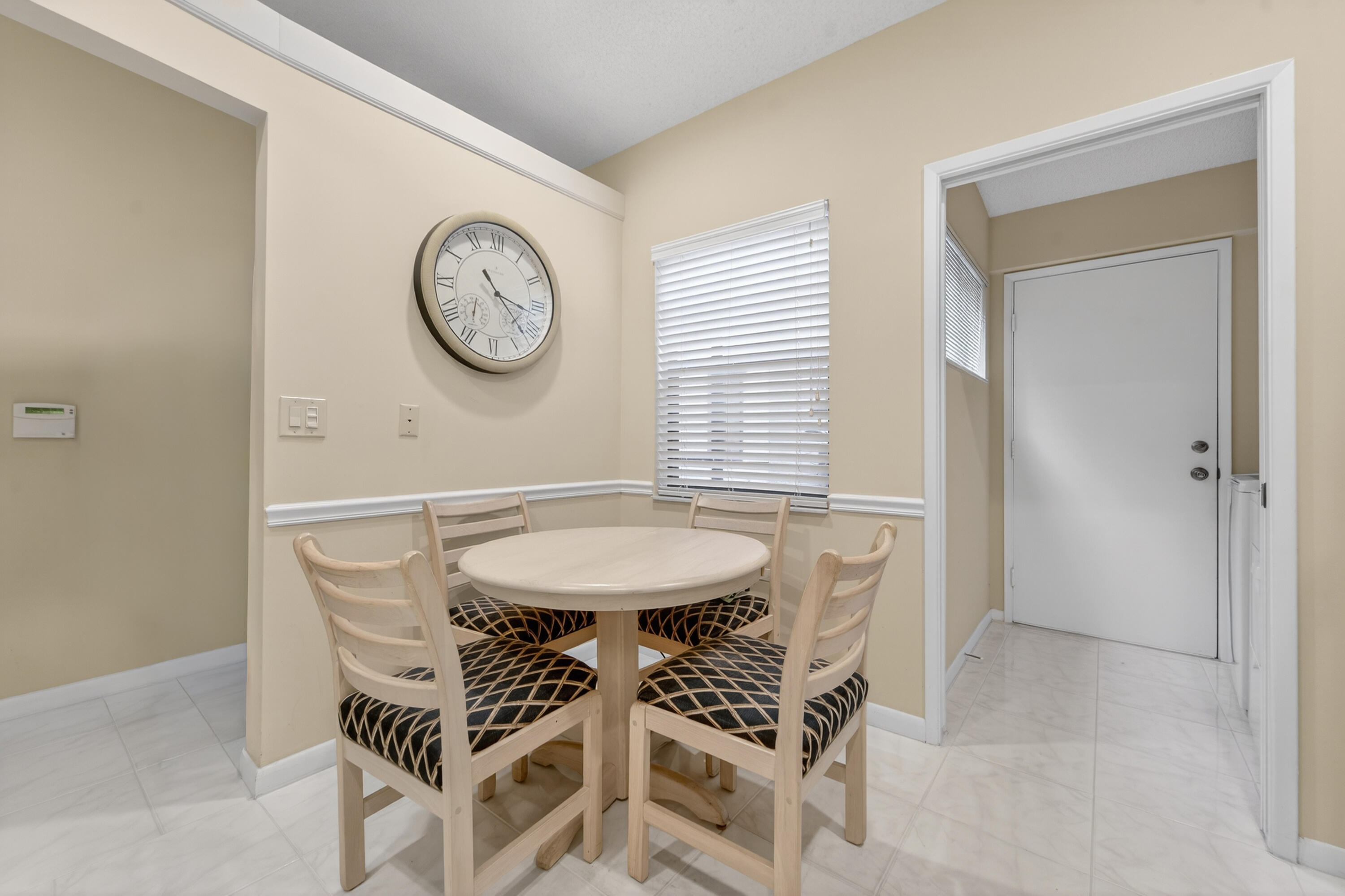 6224 Kings Gate Circle Delray Beach, FL 33484 - Photo 20 of 53 a view of a dining room and livingroom with furniture