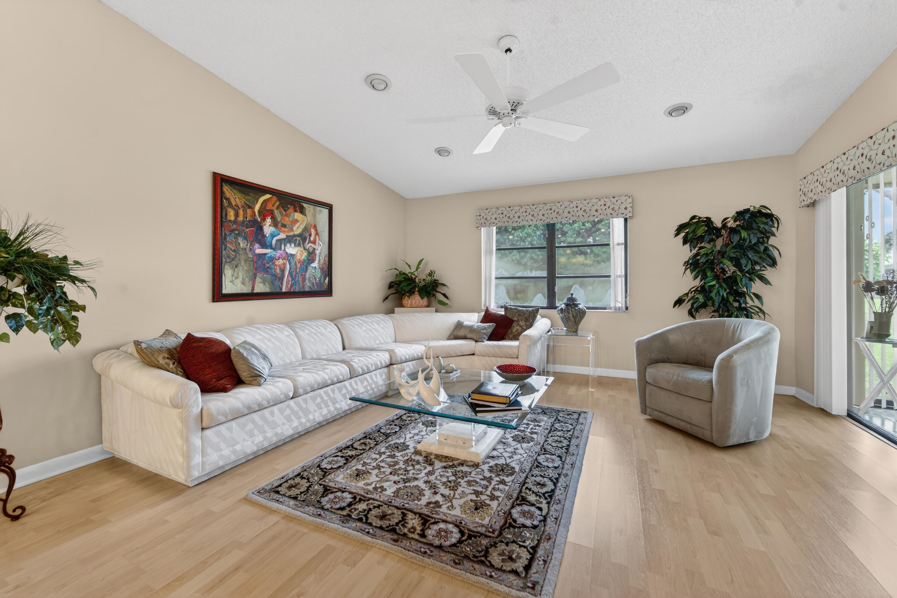 6224 Kings Gate Circle Delray Beach, FL 33484 - Photo 2 of 53 a living room with furniture a rug and a large window