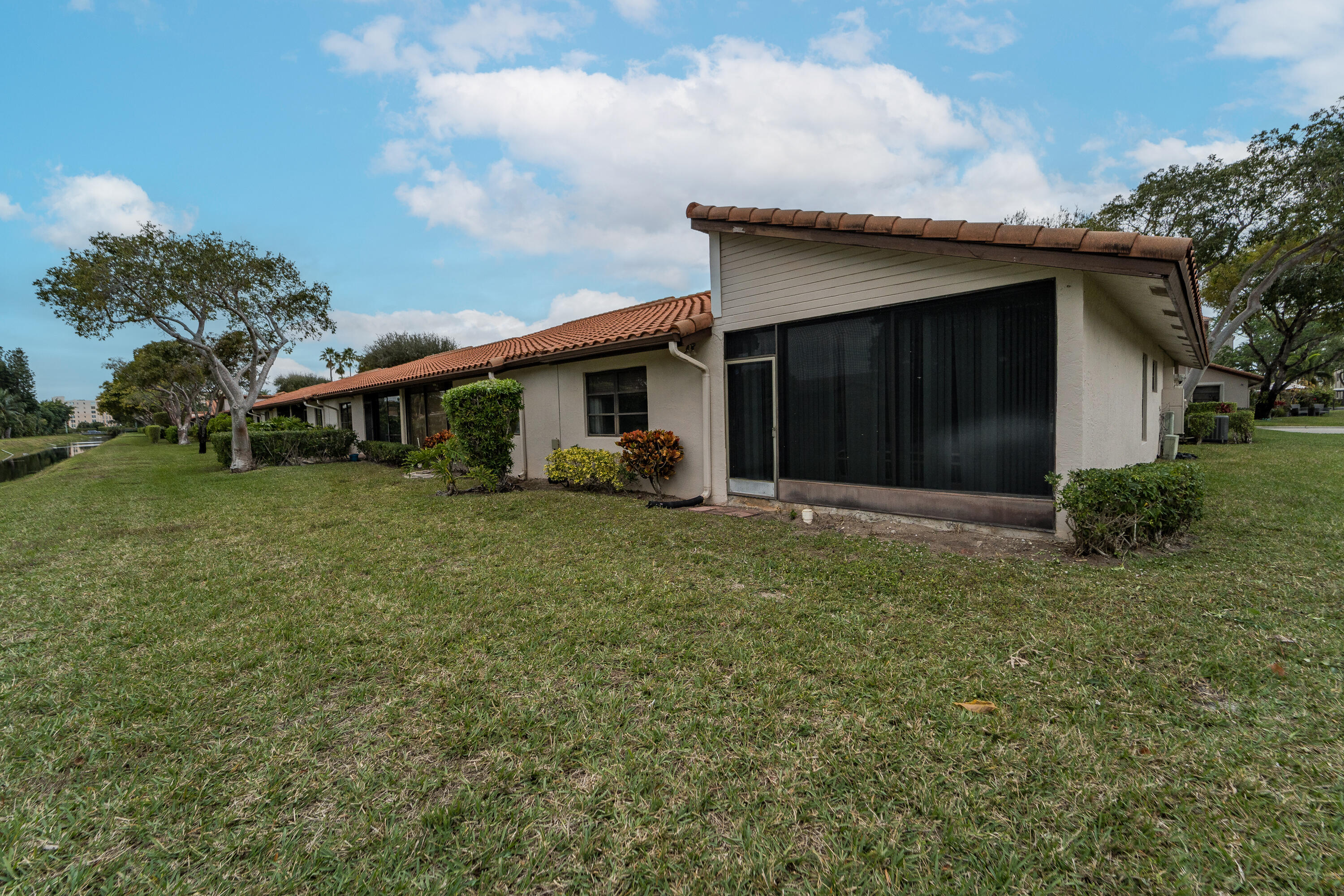6224 Kings Gate Circle Delray Beach, FL 33484 - Photo 48 of 53 a view of a house with a yard