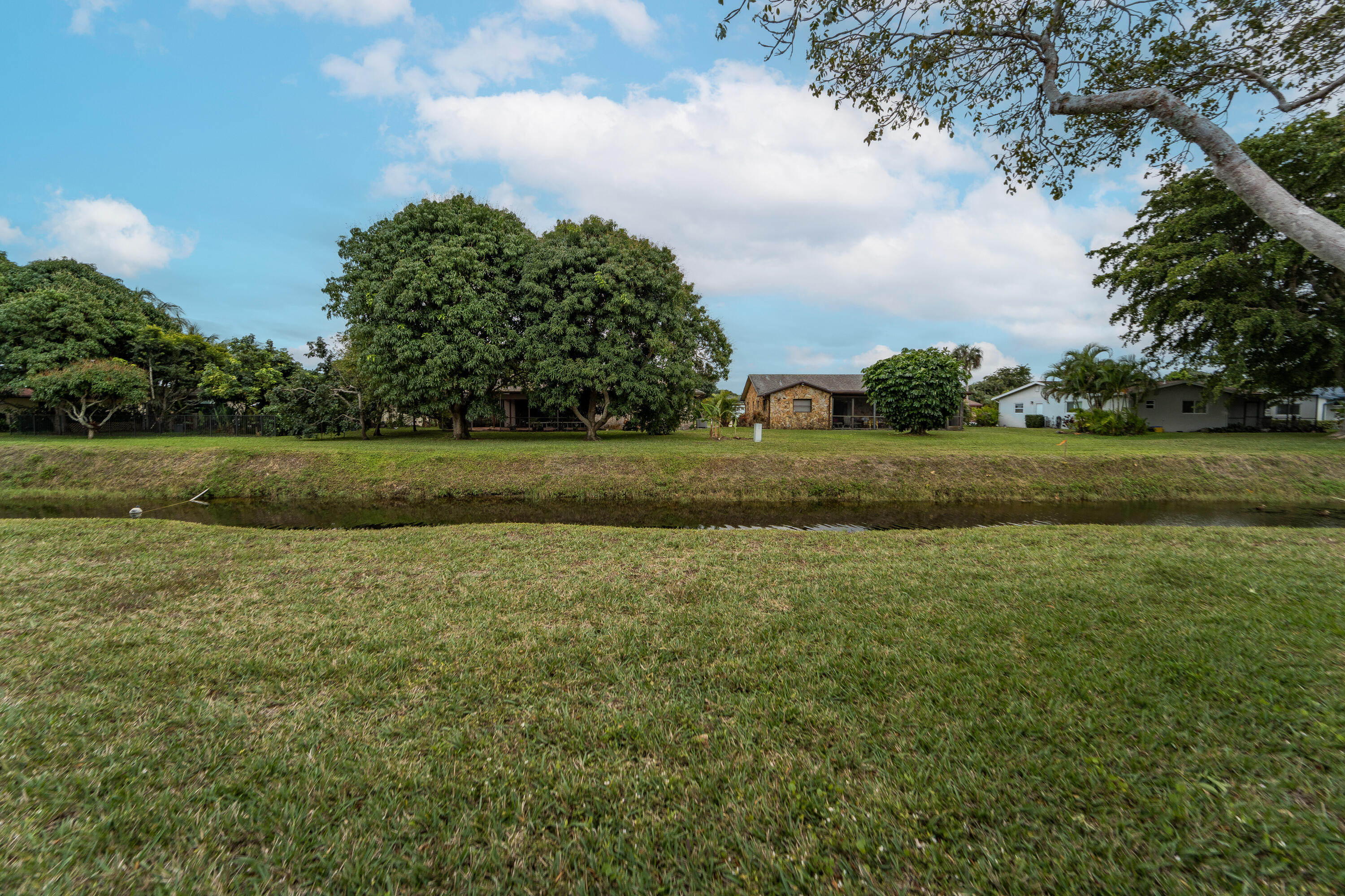 6224 Kings Gate Circle Delray Beach, FL 33484 - Photo 50 of 53 a view of a field with trees
