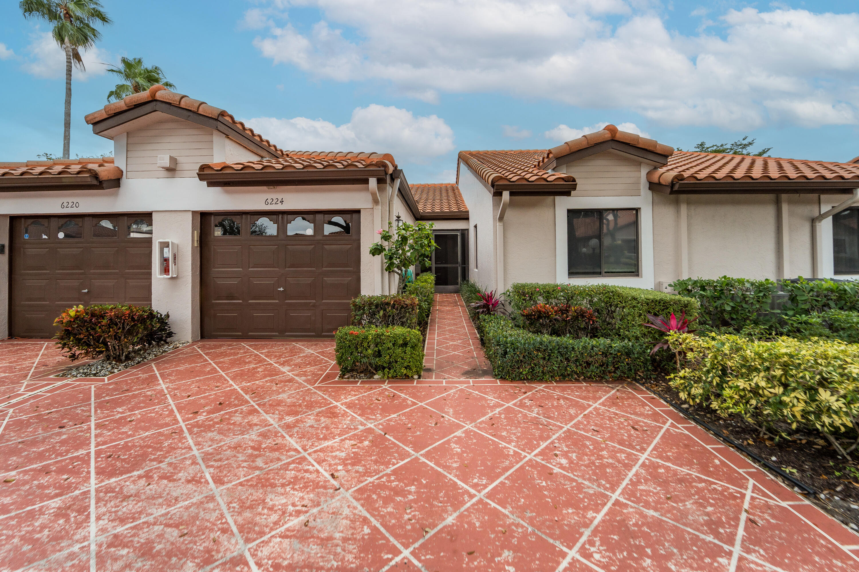6224 Kings Gate Circle Delray Beach, FL 33484 - Photo 53 of 53 a view of a house with a small yard and plants