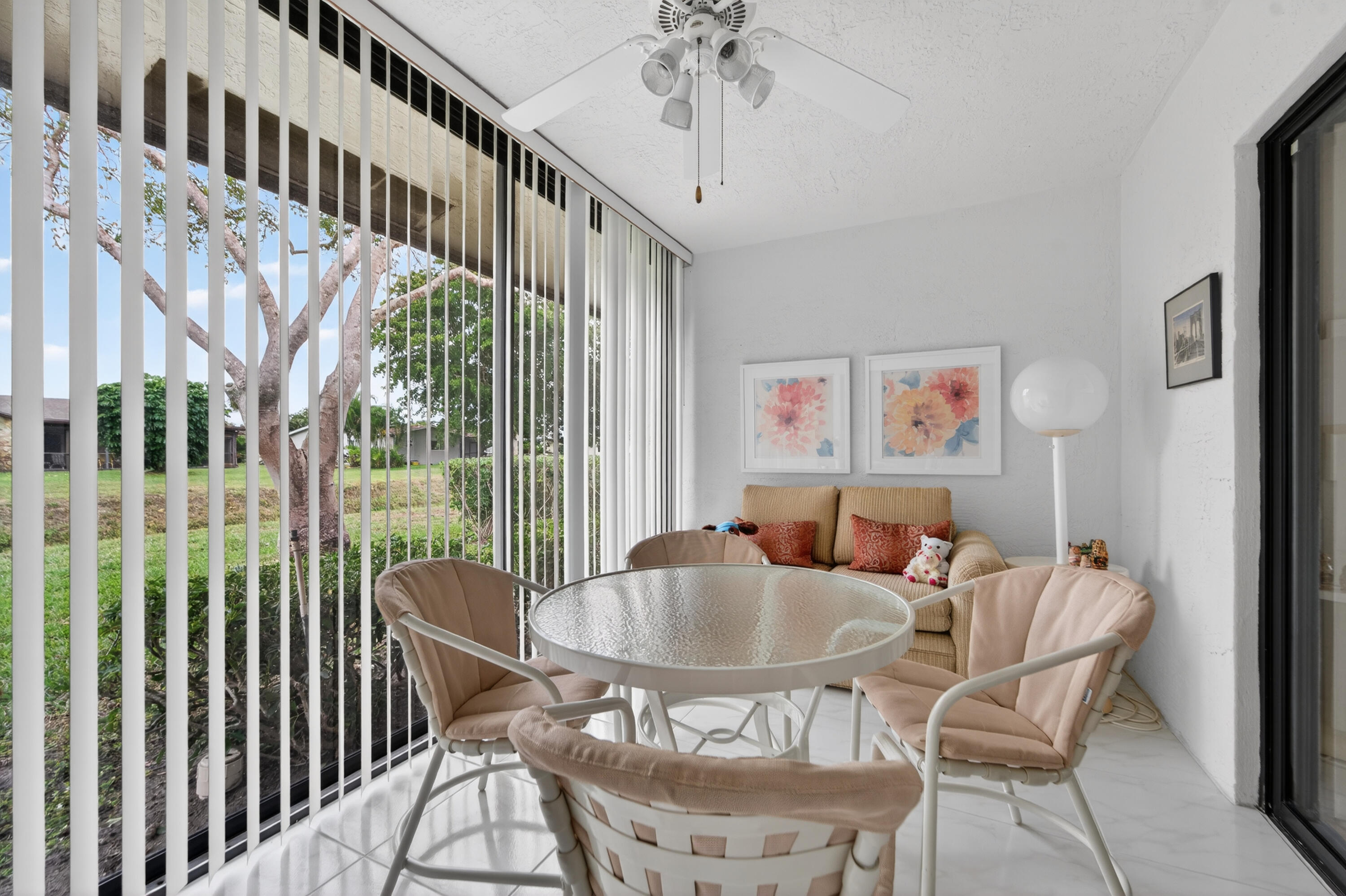 6224 Kings Gate Circle Delray Beach, FL 33484 - Photo 9 of 53 a dining room with furniture a rug and a chandelier