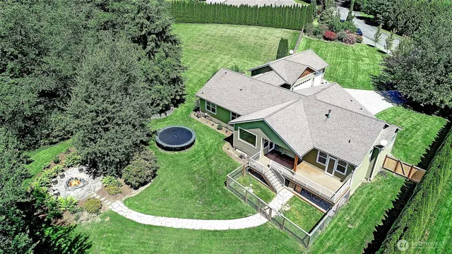 an aerial view of a house with outdoor space