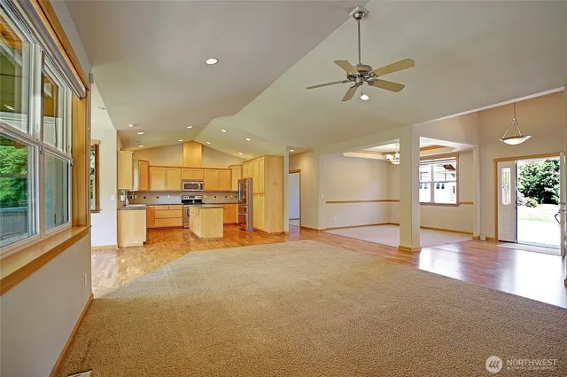 a view of a kitchen with a sink and a window